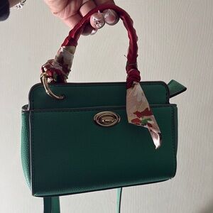 Green Handbag with Red and Cream Accents